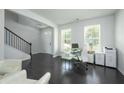 Bright home office features hardwood floors, natural light, and staircase at 2649 Ogden Trl, Buford, GA 30519
