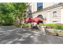Lovely entrance to the building showcasing a red awning and professional landscaping at 2865 Lenox Ne Rd # 504, Atlanta, GA 30324