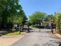 Secure gated entrance to the community, enhancing privacy and security for residents at 574 Trillum Sw Ct, Marietta, GA 30008
