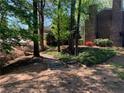 Landscaped pathway featuring natural wooded beauty, small bridges and winding trail at 574 Trillum Sw Ct, Marietta, GA 30008