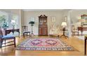 Comfortable living room featuring hardwood floors, an area rug, and neutral paint at 2473 Kings Arms Dr, Atlanta, GA 30345