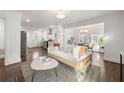 Bright open floor plan with a stylish living room flowing into the dining and kitchen areas at 1612 Alder Se Ct, Atlanta, GA 30317
