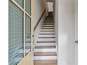A long staircase ascends from the front door, featuring wooden steps and a handrail at 1227 Cushenberry Ln, Atlanta, GA 30318
