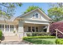 Charming home with a brick facade, lush landscaping, and inviting front porch, perfect for relaxing and enjoying the outdoors at 1012 Bellevue Ne Dr, Atlanta, GA 30306