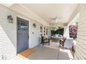 Inviting front porch with comfortable seating, a porch swing, and stylish decor, great for relaxing and entertaining guests at 1012 Bellevue Ne Dr, Atlanta, GA 30306