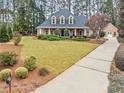 Traditional home with long driveway, and large front yard at 2407 Honey Ct, Mcdonough, GA 30252