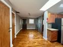 Bright living room featuring hardwood floors and a stylish glass divider, creating an inviting space at 562 Formwalt Sw St # 4, Atlanta, GA 30312