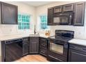 Updated kitchen with granite countertops, subway tile backsplash, and stainless steel appliances at 948 Reed Ave, Atlanta, GA 30344