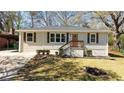 Well-maintained home with neutral siding, complemented by a manicured lawn and attractive landscaping at 2215 Gordon Se Cir, Smyrna, GA 30080