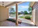 Relaxing porch view showcasing mature trees and lush landscaping in a serene neighborhood at 28 Summer Nw Pl, Cartersville, GA 30121