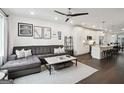 Living room adjacent to a modern kitchen with island and stainless appliances at 1050 Stacks Ave # 1507, Atlanta, GA 30315