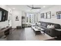 Open-concept living room with a large sectional couch and a modern entertainment center at 1050 Stacks Ave # 1507, Atlanta, GA 30315