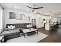 Open-concept living room flows into a modern kitchen, complete with stylish furnishings and natural light at 1050 Stacks Ave # 1507, Atlanta, GA 30315
