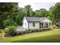 Cozy home with a well-manicured lawn and tidy landscaping, offering great curb appeal and a peaceful setting at 1711 Terry Mill Se Rd, Atlanta, GA 30316