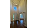 Welcoming foyer with high ceilings, hardwood floors, chandelier, and natural light at 71 Tobinleigh Ct, Acworth, GA 30101