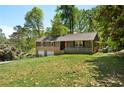 Beautiful two-story home with a spacious front yard, brick accents, and lush greenery at 3105 Sumac Dr, Atlanta, GA 30360