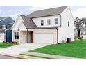 Beautiful two-story home with white siding, brick accents, a two-car garage, and a well-maintained lawn at 602 Belshire Dr, Acworth, GA 30102