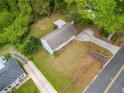 Aerial view of a home showcasing the roof, driveway, and spacious backyard with mature trees at 244 Pauladean Se Cir, Marietta, GA 30067