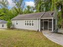Charming home featuring a screen porch and well-maintained lawn at 244 Pauladean Se Cir, Marietta, GA 30067