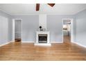 Light-filled living room boasts wood floors and a charming fireplace at 244 Pauladean Se Cir, Marietta, GA 30067