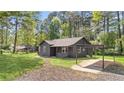 A cozy single-story house with a carport offering convenient parking space at 3917 Dallas Acworth Nw Hwy, Acworth, GA 30101