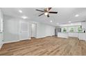 Bright, open living room with stylish ceiling fan and durable wood-look flooring at 3917 Dallas Acworth Nw Hwy, Acworth, GA 30101