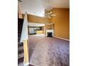 Spacious living room with a fireplace, high ceilings, and neutral carpeting throughout at 4194 Wesley Ln, Decatur, GA 30035
