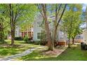 Side view of a two-story home with a spacious lawn and mature trees at 1008 Lena Nw St, Atlanta, GA 30314