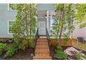 Inviting front porch with brick steps and decorative security door at 1008 Lena Nw St, Atlanta, GA 30314