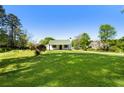 Beautiful front lawn of a home featuring a well-manicured lawn and landscaping at 3556 Finch Sw Rd, Powder Springs, GA 30127