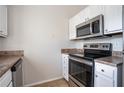 Clean kitchen equipped with stainless steel appliances and light-colored countertops at 3721 Longview Dr, Douglasville, GA 30135