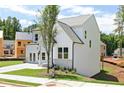 Two-story home with white siding, well-manicured lawn, and a paved driveway at 417 Newland Way, Acworth, GA 30102