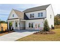 Lovely two-story home with a covered carport and a concrete driveway leading up to the property at 417 Newland Way, Acworth, GA 30102