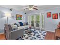 Cozy living room with a comfortable sofa, unique decorations and sliding glass doors at 1445 Monroe Ne Dr # E25, Atlanta, GA 30324