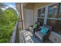 Relax on this private balcony with comfortable seating and enjoy the peaceful green views at 1850 Cotillion Dr # 3307, Atlanta, GA 30338