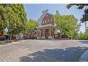 Charming brick condo building with arched entryway and mature trees, offering an inviting curb appeal at 1850 Cotillion Dr # 3307, Atlanta, GA 30338