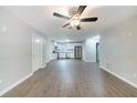 Open-concept view showcases luxury vinyl plank flooring and an updated kitchen with stainless appliances at 210 Meadowbrook Dr, Mcdonough, GA 30253