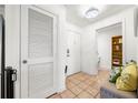 Welcoming hallway with tan tile flooring and entry to bathroom and closet at 1101 Juniper Ne St # 1519, Atlanta, GA 30309