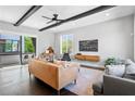 Bright living room featuring hardwood floors, modern furnishings, and access to a balcony with a view at 1331 Iverson Ne St # A, Atlanta, GA 30307