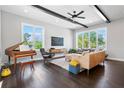 Bright living room with dark hardwood floors, piano, modern furniture, and ample natural light at 1331 Iverson Ne St # A, Atlanta, GA 30307