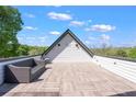 The rooftop patio features stylish seating, offering a private outdoor space with scenic views at 1331 Iverson Ne St # A, Atlanta, GA 30307
