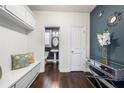 Beautiful mudroom includes storage, seating, and a view to a powder room and stylish decor and accents at 144 Still Pine Bnd, Smyrna, GA 30082