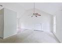 Bright living room featuring high ceilings, a ceiling fan, fireplace and neutral decor at 3311 Basking Shade Ln, Decatur, GA 30034