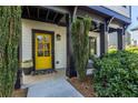 Inviting front door with a bright yellow finish, adding a cheerful touch to the exterior at 1014 Braeburn Ln, Decatur, GA 30030
