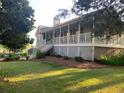 Charming home with a spacious front porch and meticulous landscaping in a serene neighborhood at 1424 Belmont Rd, Villa Rica, GA 30180