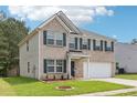 Beautiful home showcasing brick and siding and a well-kept lawn at 6904 Estepona St, Atlanta, GA 30349