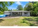 Cozy single-story home with attached garage and covered front porch at 135 Longview Rd, Fayetteville, GA 30214
