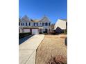 Inviting townhouse with a two-car garage and a well-maintained front yard at 3723 Verde Glen Ln, Cumming, GA 30040