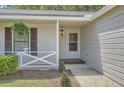 Inviting front porch entrance with hanging plants and decorative shutters at 2939 Owens Point Nw Trl, Kennesaw, GA 30152