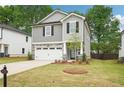 Charming two-story home boasts stone accents, a well-kept lawn, and a cozy, inviting atmosphere at 4785 Marjorie Dr, Cumming, GA 30041